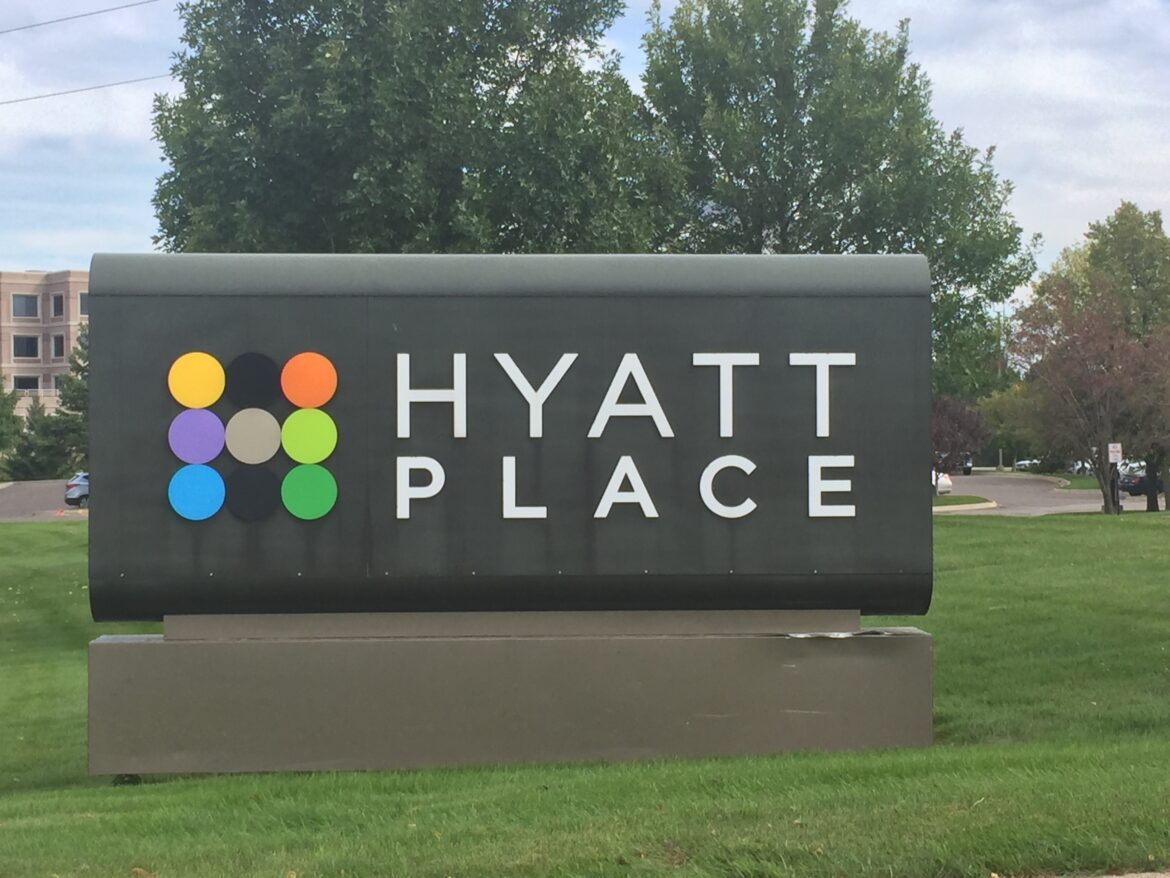 a sign in front of a building