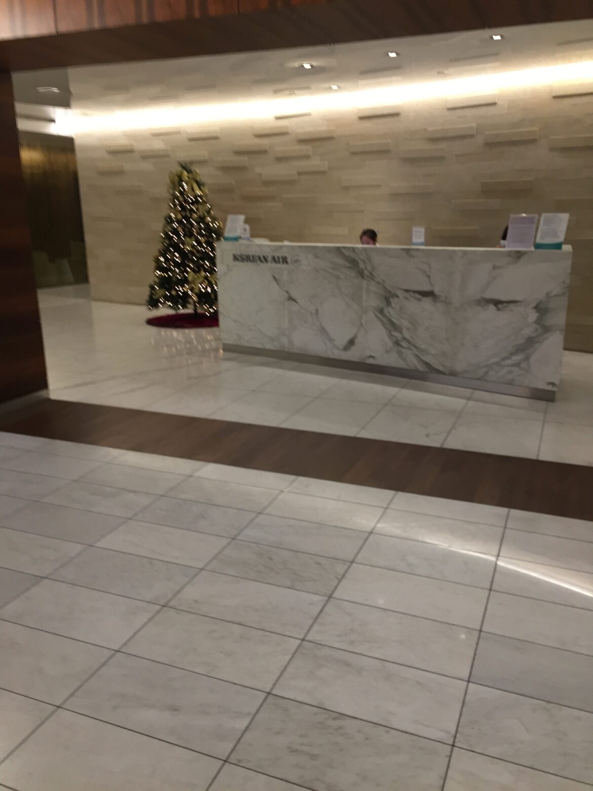 a marble reception desk in a building