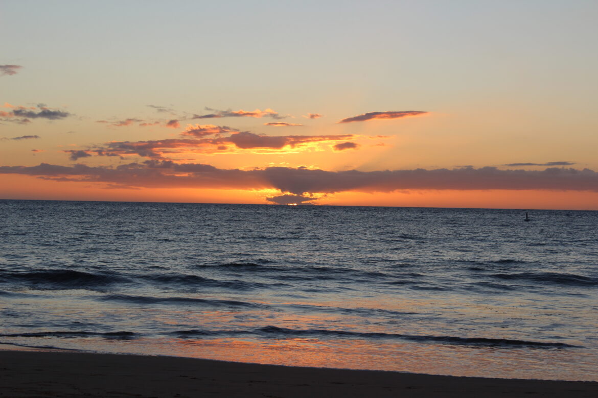 a sunset over a body of water