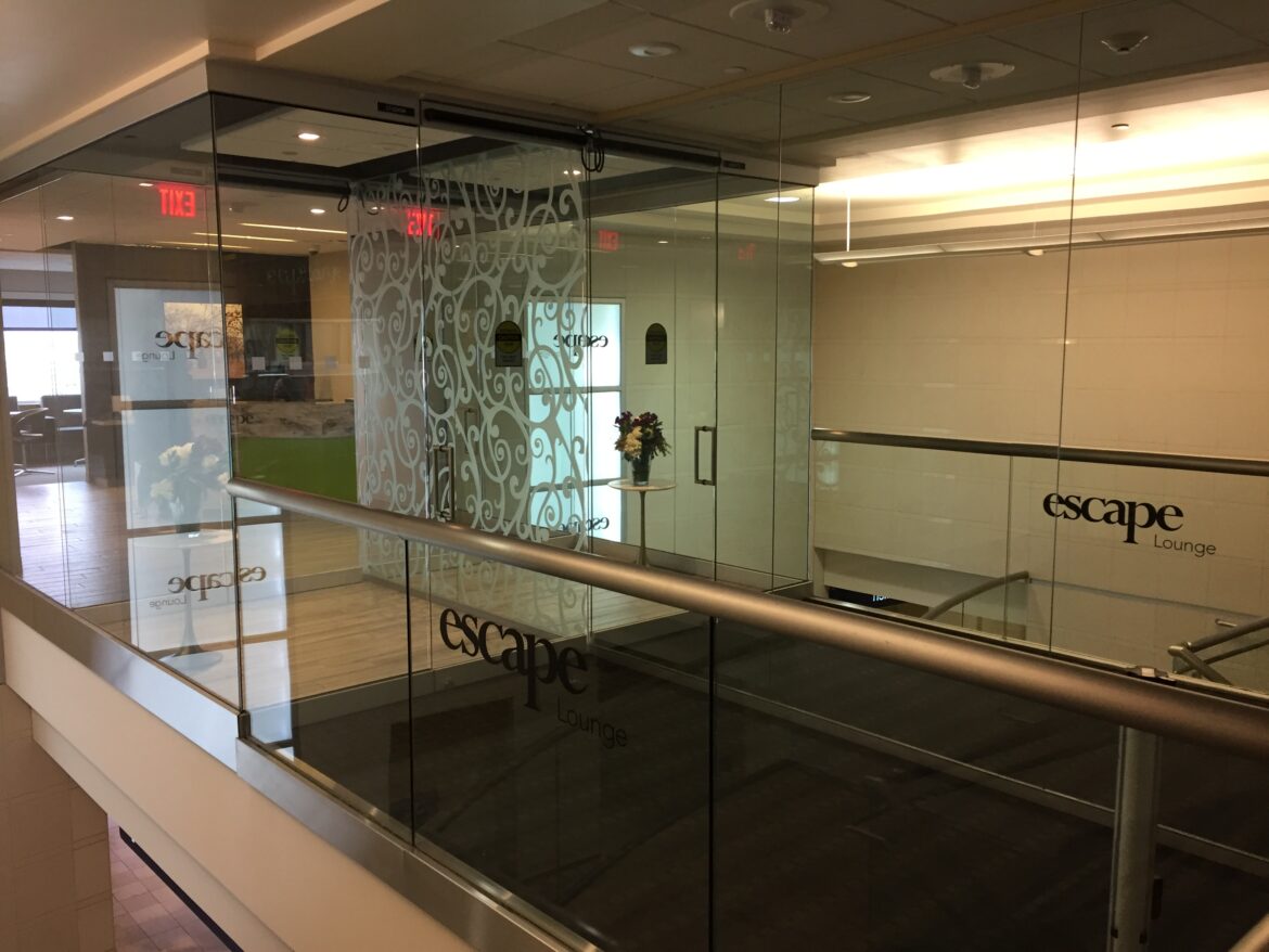 IMG_8036 a glass wall with a railing