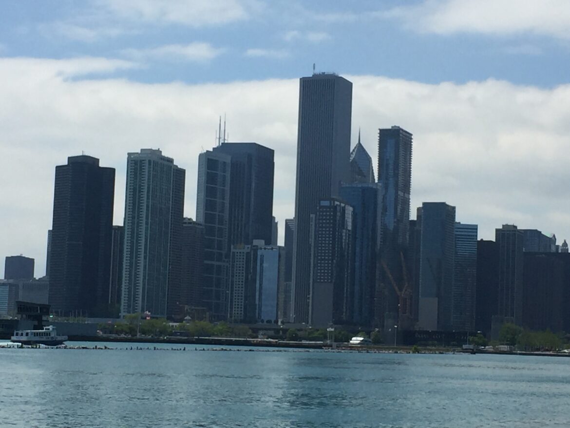 Renaissance Center skyline with tall buildings and a body of water