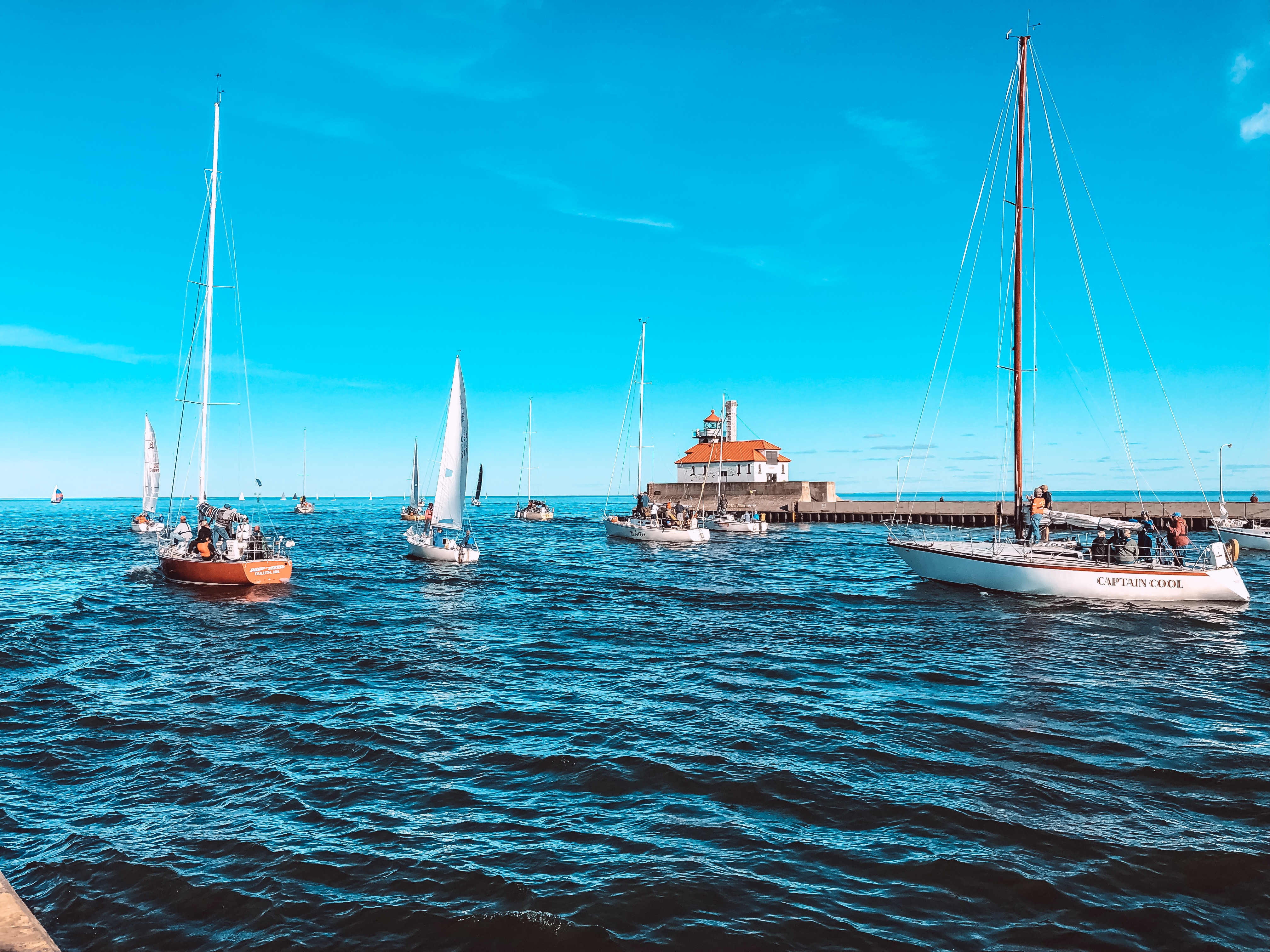 a group of sailboats in the water