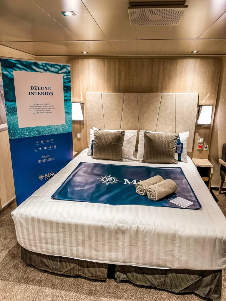 a bed with a blue mat and towels on it