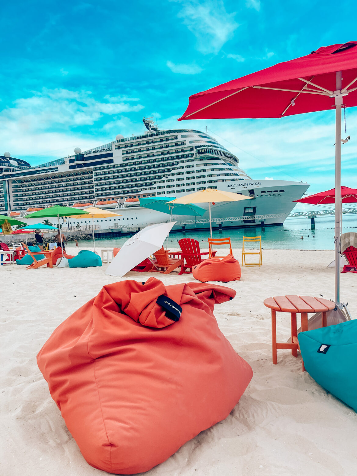 MSC Meraviglia at colorful beach at Ocean Cay
