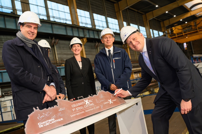 Executives signing the steel cutting for Xcel