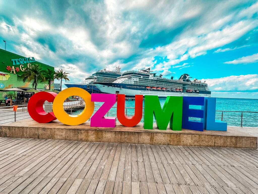 Cozumel Sign with Celebrity Constellation and Celebrity Equinox in view