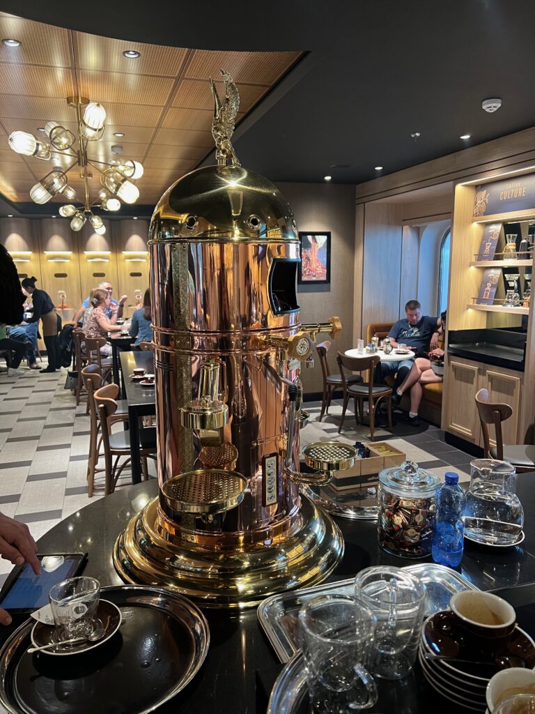 a large gold and silver machine in a restaurant